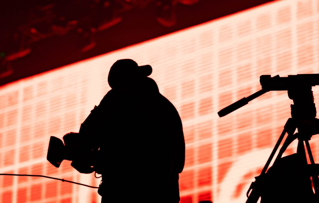 cameraman silhouette in stage lights